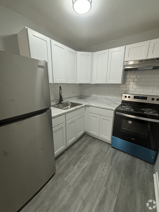 Updated kitchen in 1-bedroom - Prescott Arms Apartments