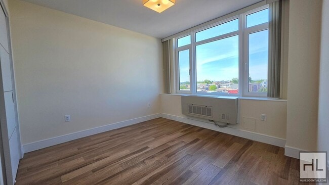 Photo - Top-Floor 1-Bedroom with Private Balcony & Manhattan Skyline Views! Unit 7B