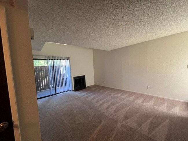 Photo - Freshly painted condo with new carpet in gated community.