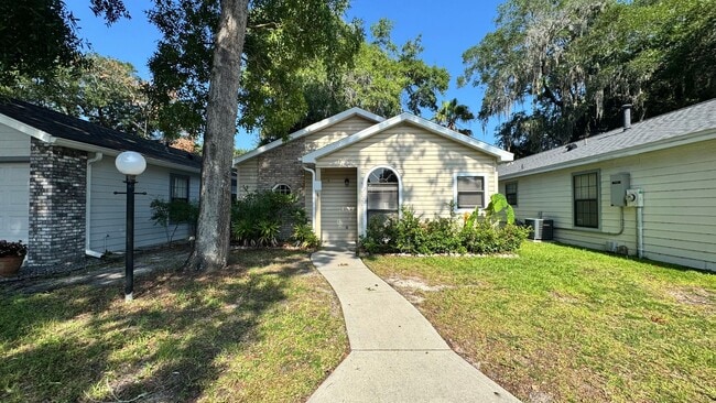 Photo - Spacious 2BR/2BA Home with Screened Porch & Fenced Yard For Rent!