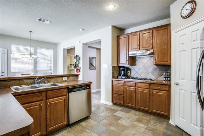 Photo - Immaculate home on a beautifully landscaped lot, tandem garage, plenty of storage!