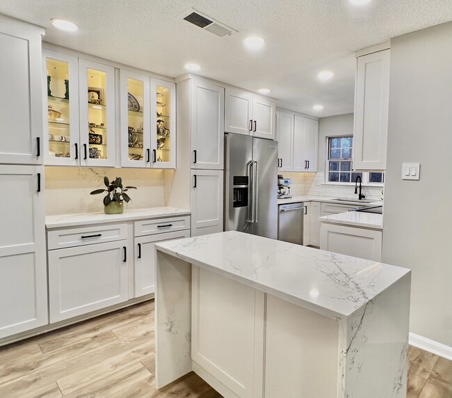 Kitchen w/ Island - 3800 Green Ridge Ct Condo Unit 201