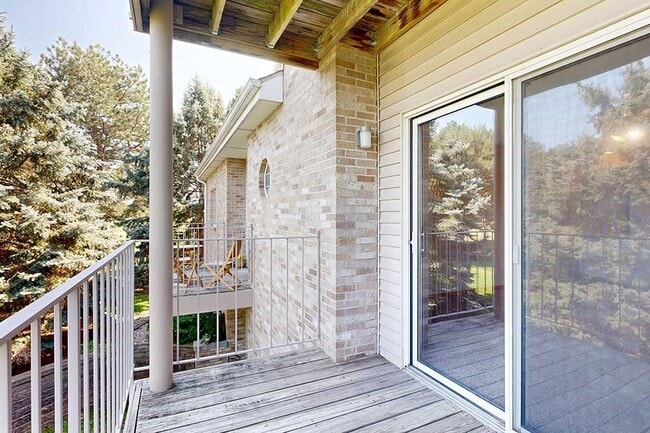 Covered balconies offer comfortable outdoor spaces to unwind while taking in peaceful views of surrounding greenery. - Skyline View