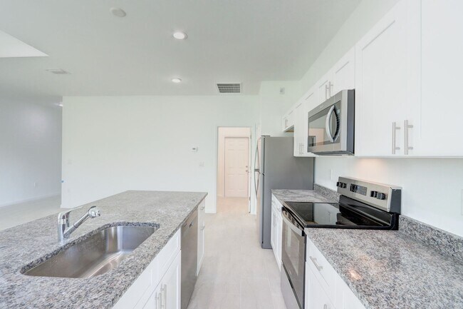 Photo - Brand New 3/2/2 + Den-Great location in SW...