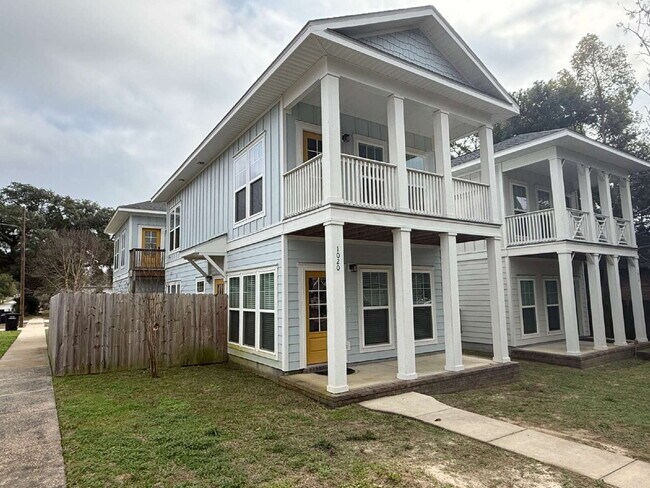 Photo - **Available now. This pet-friendly property features a small fenced yard with water and lawn main...