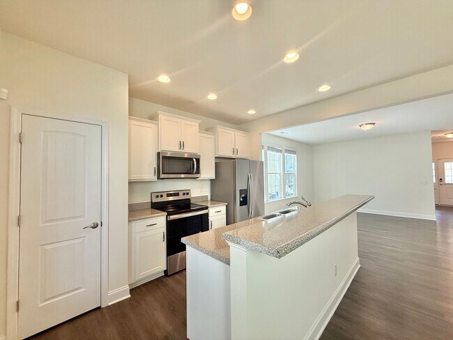 Photo - Spacious 3BD, 2.5BA End Unit Raleigh Townhome Near White Oak Shopping Center, I-40, and Downtown ...