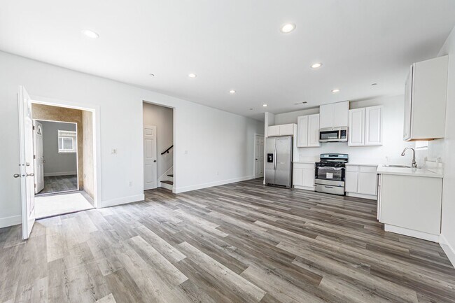 Photo - Spacious 4-Bedroom, 3-Bath Home – Modern Upgrades & Parking Included Unit 2833 1/2