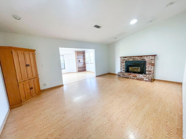 Photo - This gorgeous Pine Hills home has a large interior, 2-car garage, and fully-fenced yard!