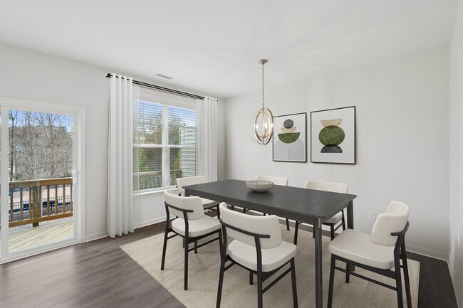 Upgrade Package Kitchen and dining area with hard-surface vinyl plank flooring - Avalon Townhomes Brier Creek