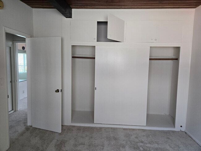Bedroom new paint, wall to wall closets, storage, new carpetabove