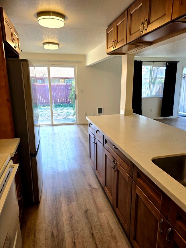 Kitchen- new appliances, dining room, yard - 1045 S Jasper St Unit #B