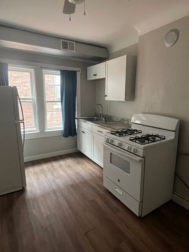 Great, roomy kitchen with a lot of natural light! - 2004 E 125th St