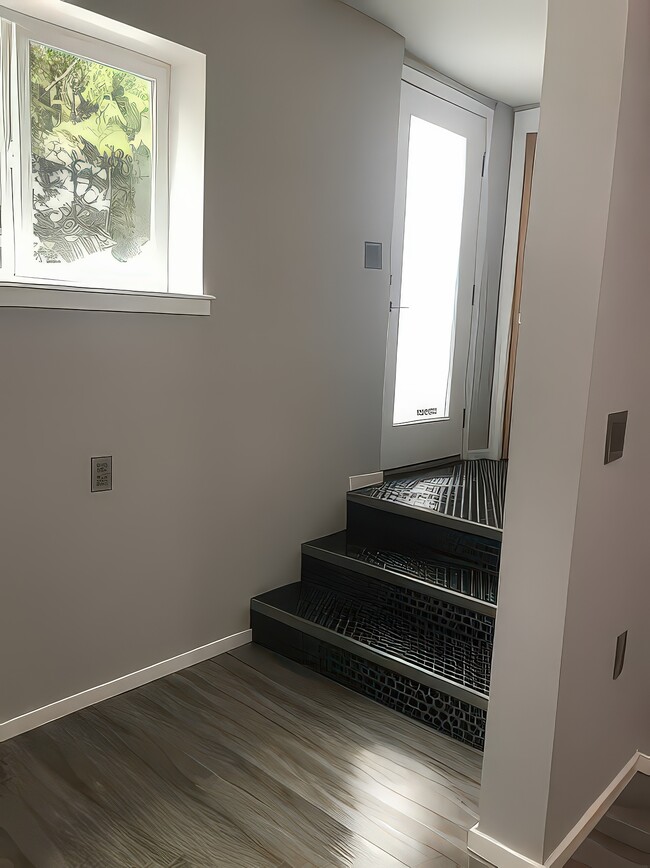 Steps down from entry - 831 NE Holland St Unit B