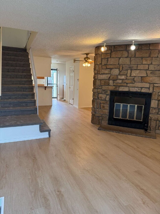 Photo - Cozy 2 Bed, 1.5 Bath Townhouse with Fireplace + Community Pool + Reserved Parking Space! Unit A
