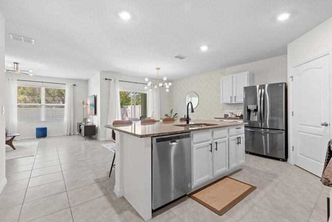 Photo - 4BR Under $2,300/mo | Tesla Charger | 15 Min to Lake Nona
