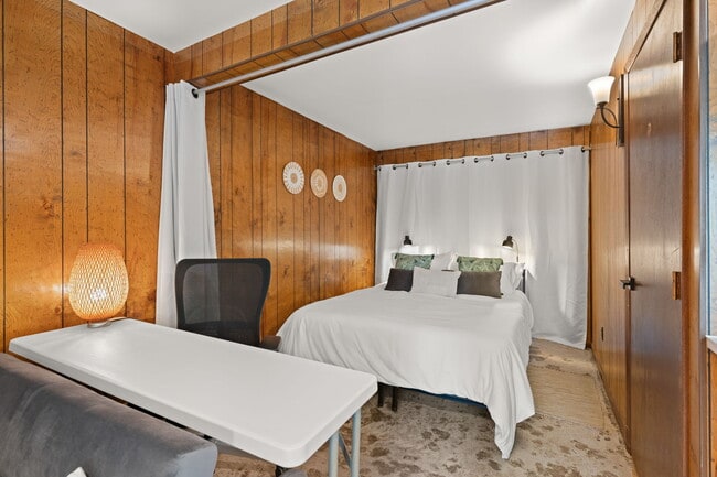 The queen bed is curtained for privacy. - Cross Lake Estates - Furnished Rentals