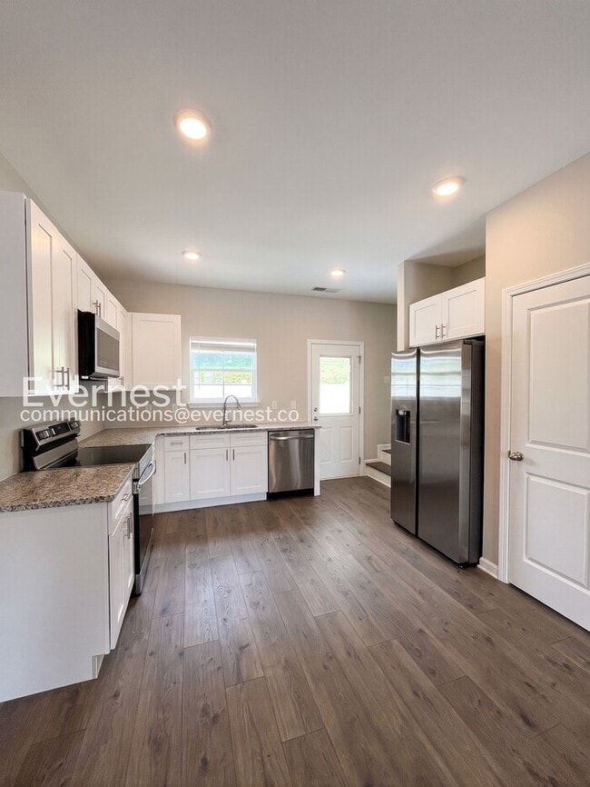 Photo - 2-Bed/3-Bath Townhouse with Modern Amenities/ Pet-Friendly /Available Now!