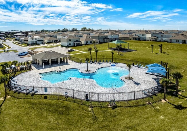 Resort-style pool with splash feature, cabana, and plenty of room to unwind.