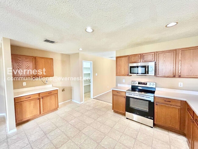 Photo - 4 Bed, 2 Bath Home with Fenced Yard & Garage / Available Now!