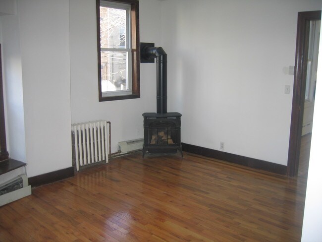 bed with fireplace - 16 46th St Unit 2