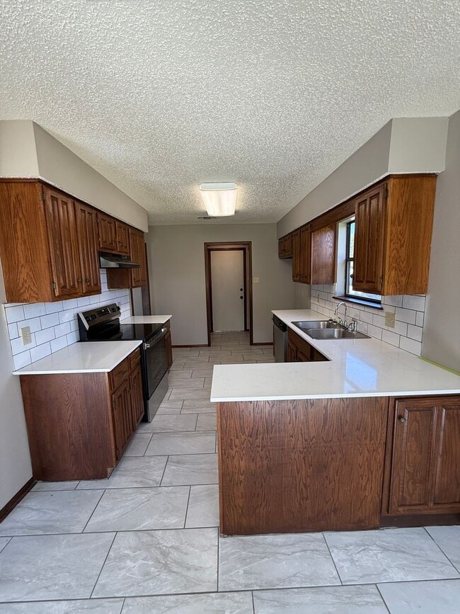 Photo - 3 Bed 2 Bath Duplex with 2 Car Garage. Gas Heat & Hot Water.