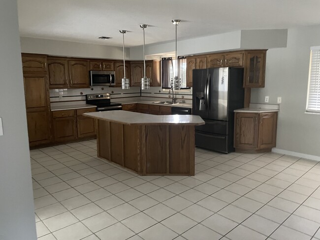 kitchen has island and newer applicances - 302 Coronation Dr