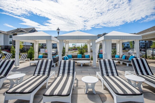 Expansive Pool Area with Cabanas