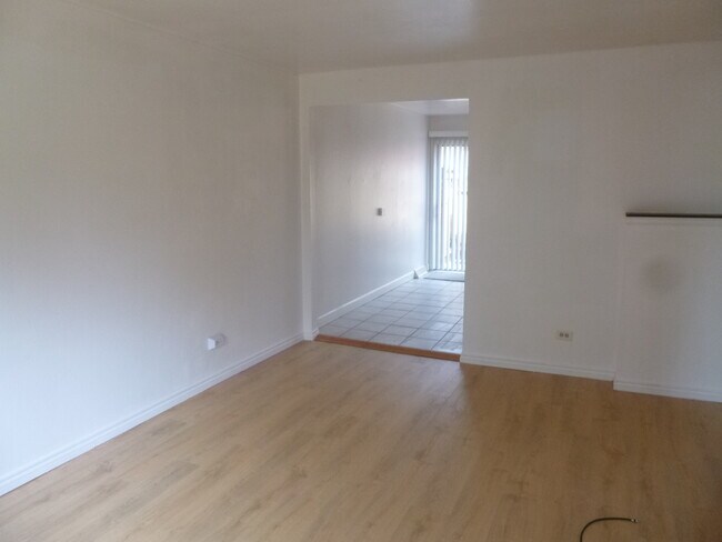 LIVING ROOM TOWARDS KITCHEN - 720 Miller Ct