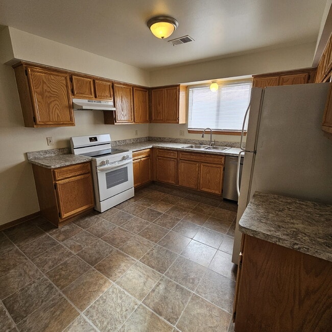 Photo - 2 Bedroom Upper Condo w/ Open Kitchen to Living Room Space. All Appliances Included along with Wa...