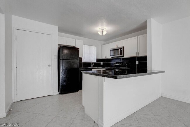 Building Photo - 5396 S Swenson St Unit 30
