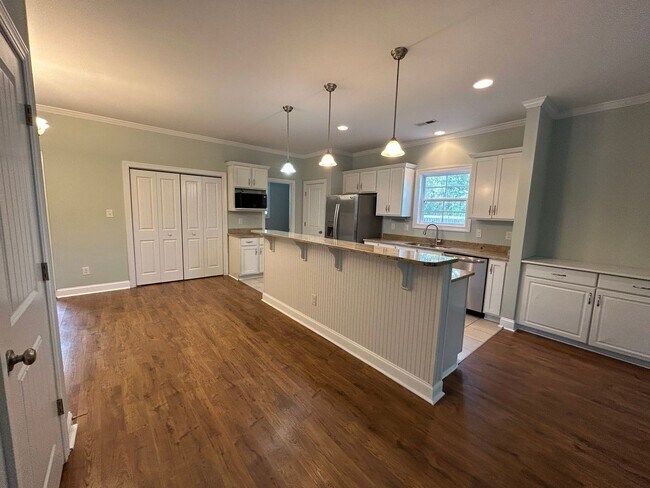 Photo - Enjoy private living in this beautiful 3 bedroom, 2.5 bathroom home on almost half acre lot!