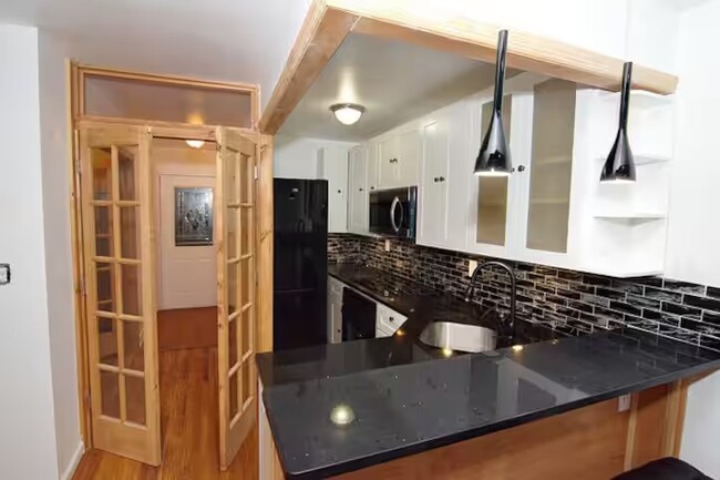 Kitchen and Entryway - 592 Junius St Apartments Unit # 1