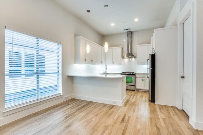 Photo - Beautiful townhome featuring granite countertops, hard wood floors, and a small private yard grea...