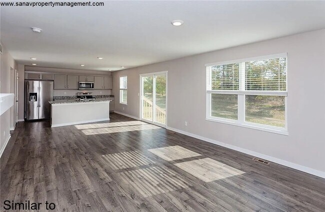 Photo - "Ankeny Oasis: Luxurious 4-Bedroom Home with Expansive 3-Car Garage and Secluded Backyard Retreat!"