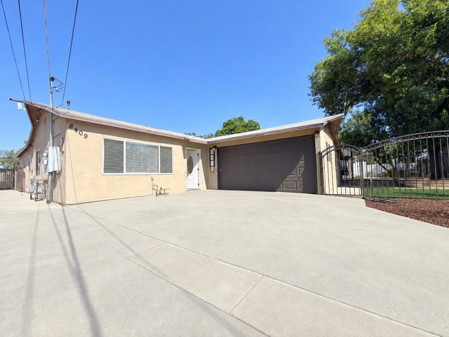 Building Photo - Spacious 4-Bedroom, 2-Bath Gated Home with Garage & Private Backyard