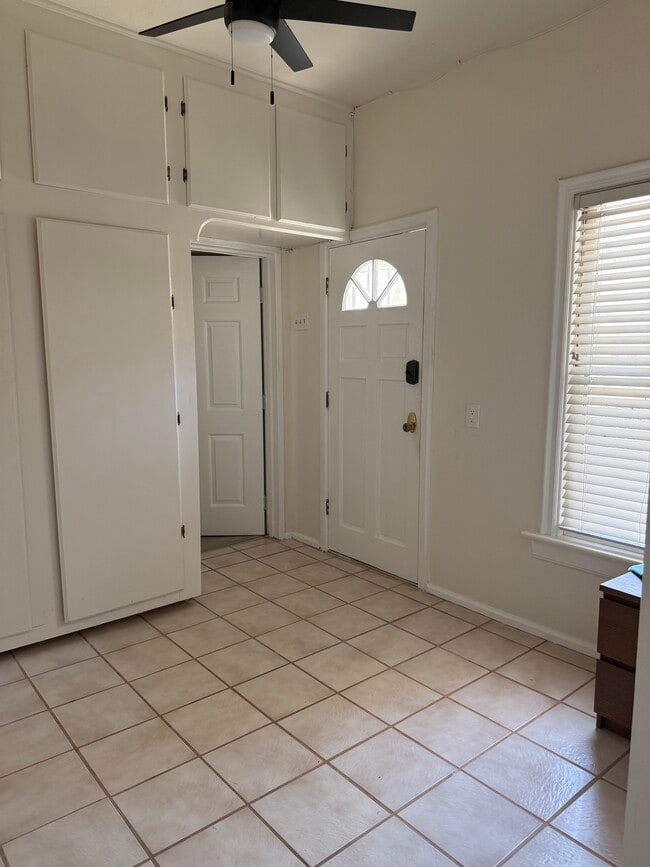 view of kitchenette looking towards entry and door to bdrm. - 305 Emerald St Unidad 305