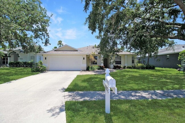 Photo - Annual rental: Spacious 3BR/2BA Creekwood Home with Office, Screened Lanai, EV Charger & Resort-S...