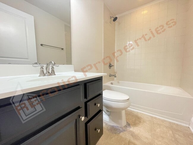 Photo - Beautiful 3 Story 3 Bedroom Townhouse with Huge 1st Floor Flex Space with Access to Patio + 2 Car...