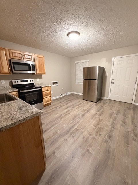 Opposite angle of the Kitchen View with the Fridge and Washer/Dryer Hook ups - 3203 Island Rd