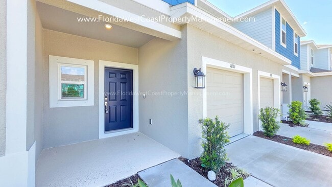 Building Photo - OUTSTANDING BRAND NEW TOWNHOME MOVE IN READY! AZARIO TOWNHOMES LWR !