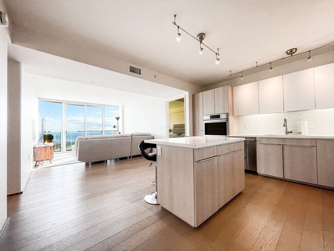 Building Photo - Furnished Symphony Condo with Direct Ocean Views and Two Parking