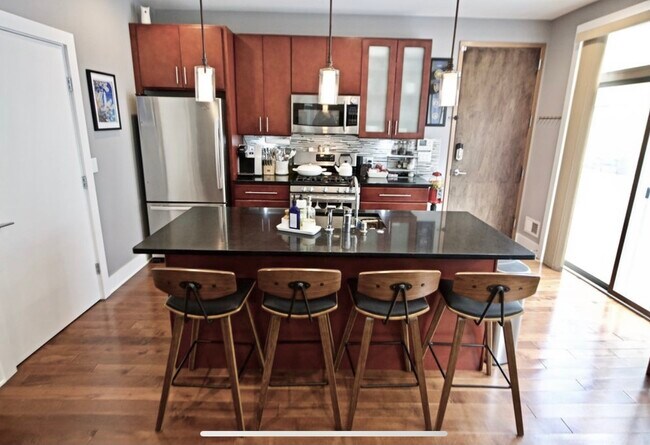 Sliding door off the kitchen to access enormous deck. - 1535 North Philip Street Unit GatedwithParkinghugePatio