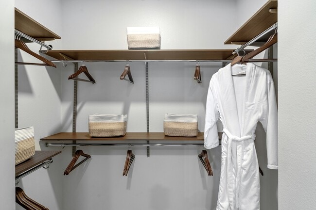 Experience luxury and organization with this elegantly designed closet space.