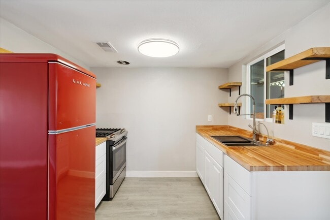 Brand new retro refrigerator with custom cut countertops and shelves. - 327 N 16th Ave Unit Apt A