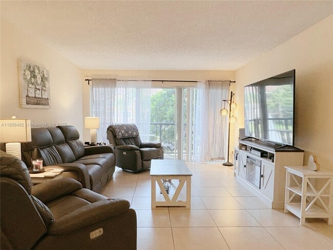 Building Photo - 9055 Wiles Rd Unit 204 Rental