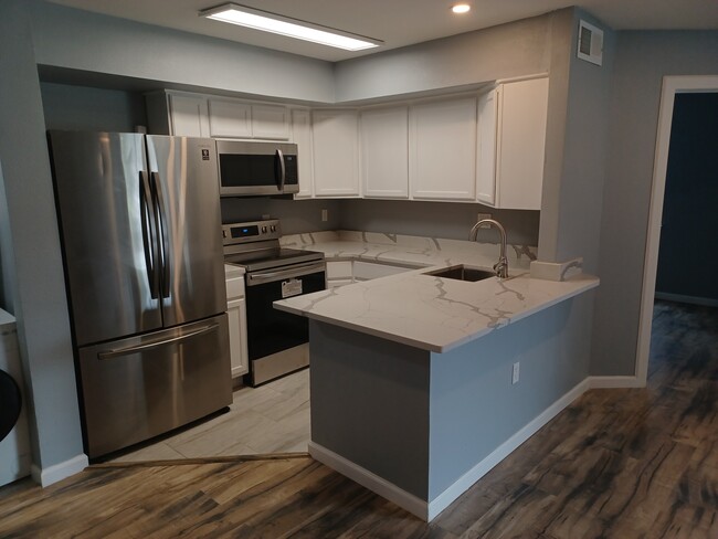 Nice size kitchen with all new appliances - 9805 Walnut St Condo Unit 106