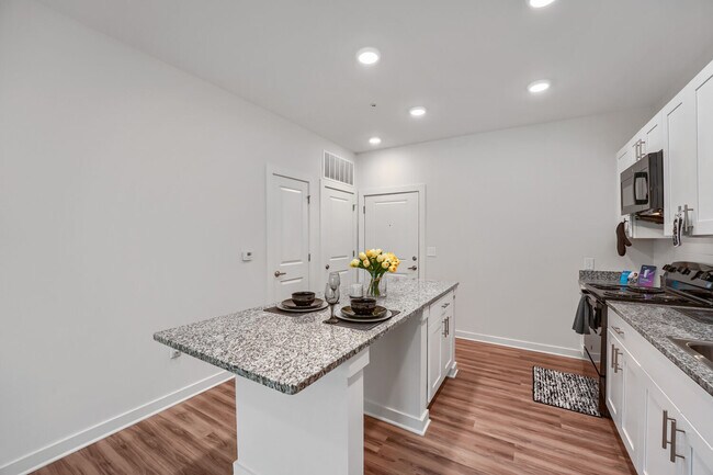 Kitchen with view of front door entrance