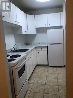 Photo - 945 Simcoe St N Unité 107