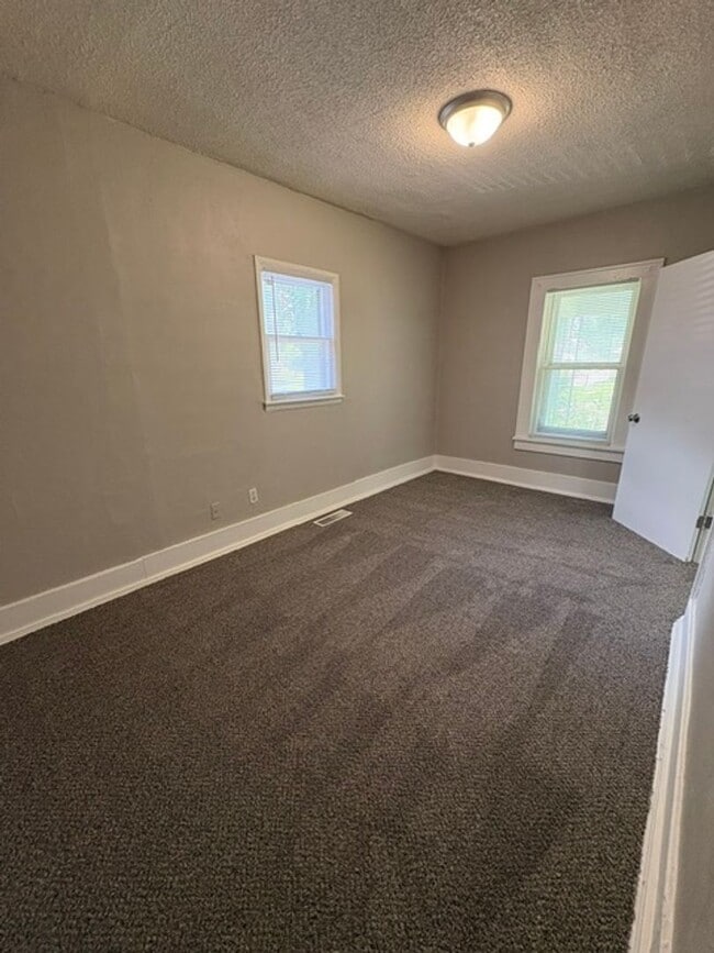 Photo - A cozy 2 bedroom home with versatile living space and plenty of storage including a partially fin...