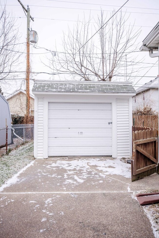 Photo - Beautiful two bedroom home with bonus room, fenced in back yard, garage, and full basement!